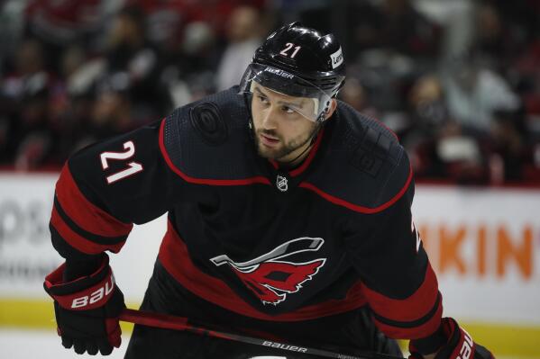 FILE - Carolina Hurricanes' Nino Niederreiter (21) waits for a face-off against the New York Rangers during the second period of Game 5 of an NHL hockey Stanley Cup second-round playoff series in Raleigh, N.C., Thursday, May 26, 2022. The Nashville Predators have signed forward Nino Niederreiter to a two-year, $8 million contract in their biggest free agency move since keeping forward Filip Forsberg off the market.  General manager David Poile announced the signing Thursday, July 21, 2022. (AP Photo/Karl B DeBlaker, File)