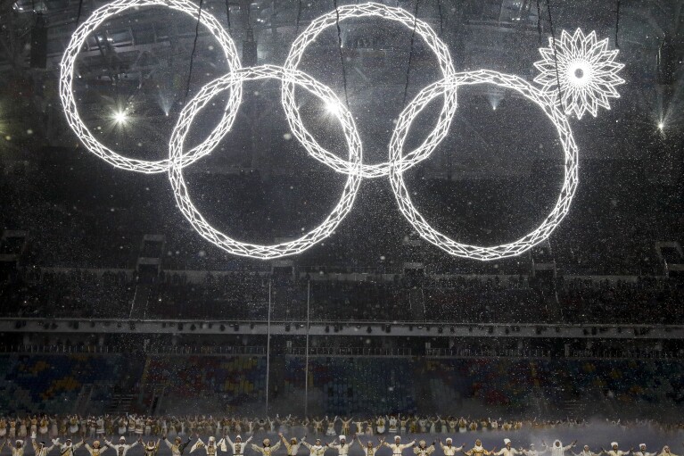 FILE - One of the rings forming the Olympic logo fails to open during the opening ceremony of the 2014 Winter Olympics in Sochi, Russia, Friday, Feb. 7, 2014. The glitch marred a majestic show of Russian history and culture during the opening ceremony. (AP Photo/Mark Humphrey, File)