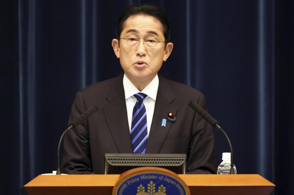 Japanese Prime Minister Fumio Kishida speaks before media members at his official residence in Tokyo, Saturday, Dec. 10, 2022, after an extraordinary Diet session. (Yoshikazu Tsuno/Pool Photo via AP)