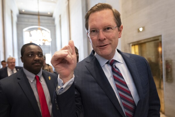 FILE - House Speaker Cameron Sexton, R-Crossville, makes his way through the state Capitol, Thursday, April 20, 2023 in Nashville, Tenn. Tennessee Republican leaders are escalating their calls to reject millions of federal dollars rather than comply with requirements over LGBTQ+ rights, abortion access and other hot-button issues. (AP Photo/George Walker IV, File)