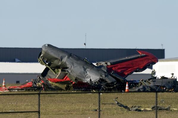Debris from two planes that crashed during an airshow at Dallas Executive Airport are shown in Dallas on Saturday, Nov. 12, 2022. (AP Photo/LM Otero)