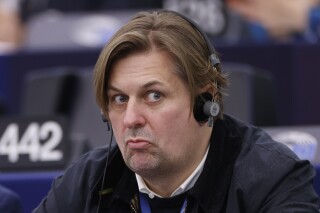 FILE -Germany's Maximilian Krah, of the German far-right Alternative for Germany party, grimaces during a session at the European Parliament in Strasbourg, France, Tuesday, April 23, 2024. German government and opposition lawmakers have assailed the far-right Alternative for Germany for its alleged closeness to Russia and China after an assistant to a legislator for the party was arrested on suspicion of spying for Beijing. This week’s arrest of an assistant to European Parliament lawmaker Maximilian Krah cast an unflattering light on Alternative for Germany (AfD). (AP Photo/Jean-Francois Badias, File)