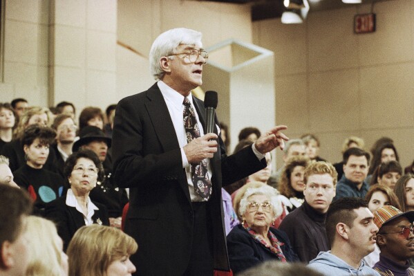 FILE - Phil Donahue hosts his television show in New York on Jan. 27, 1993. Donahue, whose pioneering daytime talk show launched an indelible television genre, has died. He was 88. (AP Photo/Mark Lennihan, File)