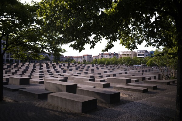 The morning light illuminate the Memorial to the Murdered Jews of Europe, or the Holocaust Memorial in Berlin, Germany, Thursday, June 15, 2023. The organization that handles claims on behalf of Jews who suffered under the Nazis said Thursday that Germany has agreed to extend another 1.4 billion Dollars, 1.29 billion Euros, overall for Holocaust survivors around the globe for the coming year. (AP Photo/Markus Schreiber)