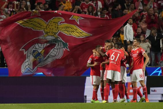 Benfica's Rafa Silva, left, celebrates with teammates after scoring his side's first goal during the Champions League group H soccer match between Benfica and Maccabi Haifa at the Luz stadium in Lisbon, Tuesday, Sept. 6, 2022. (AP Photo/Armando Franca)