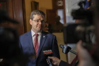 FILE - S. Chad Meredith, Kentucky solicitor general, speaks to members of the media after making arguments before the Kentucky Supreme Court at the state Capitol in Frankfort, Ky., on Thursday, June 10, 2021. On Friday, July 15, 2022, the White House dropped plans to nominate Meredith, an anti-abortion lawyer backed by Senate Republican leader Mitch McConnell, for a federal judgeship in Kentucky. (Ryan C. Hermens/Lexington Herald-Leader via AP, Pool, File)