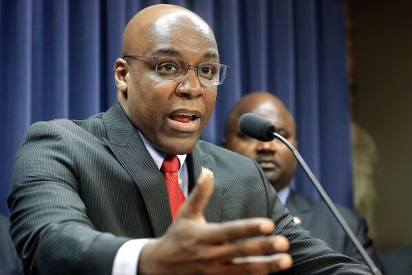 
              FILE - In this Aug. 12, 2015, file photo, Illinois State Sen. Kwame Raoul, D-Chicago, speaks during a news conference at the Capitol, in Springfield, Ill. Lawmakers and police still can't agree on the results of an Illinois racial profiling measure first pushed by then-state Sen. Barack Obama. The discussion comes as Democrats now push to make the temporary program permanent. Raoul is the sponsor of the plan. (AP Photo/Seth Perlman, File)
            