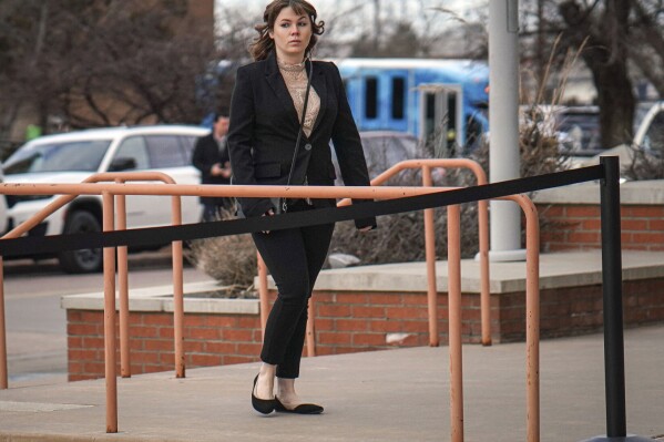 Hannah Gutierrez-Reed arrives at the First Judicial District Courthouse in Santa Fe, N.M., on Wednesday, Feb. 21, 2024, for the start of her trial on charges of involuntary manslaughter and tampering with evidence. Prosecutors in New Mexico are pursuing accountability for the 2021 death of a cinematographer who was fatally shot by actor Alec Baldwin during a rehearsal for the Western film “Rust.” (Gabriela Campos/Santa Fe New Mexican via AP, Pool)