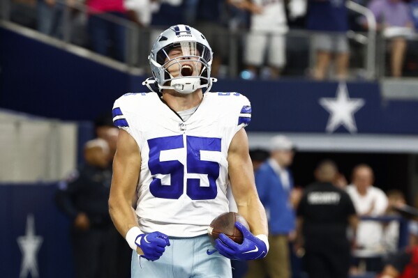 Dallas Cowboys linebacker Leighton Vander Esch celebrates after recovering a New England Patriots' Mac Jones fumble and returning it for a touch down in the first half of an NFL football game in Arlington, Texas, Sunday, Oct. 1, 2023. (AP Photo/Roger Steinman)
