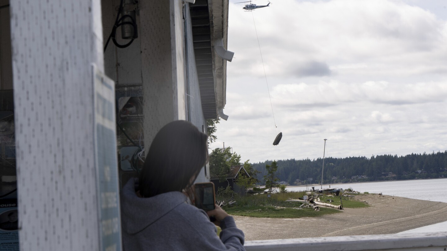 Flying boats make for a rare sight as Washington clears an island of derelict vessels by helicopter
