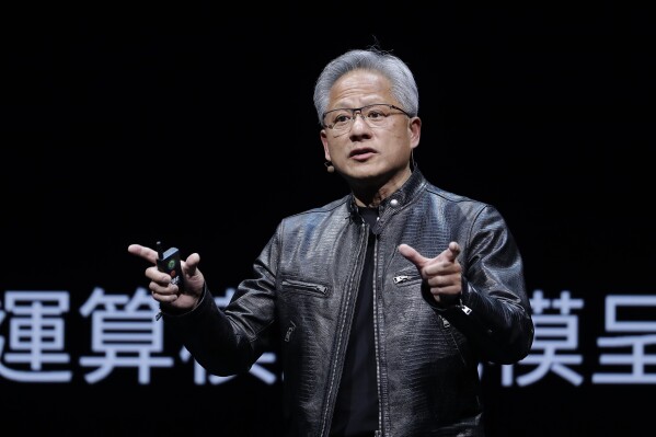 FILE - Nvidia CEO Jensen Huang speaks at the Computex 2024 exhibition in Taipei, Taiwan, June 2, 2024. Nvidia passed Microsoft on Tuesday, June 18, 2024, to become the most valuable company in the S&P 500. (AP Photo/Chiang Ying-ying, File)