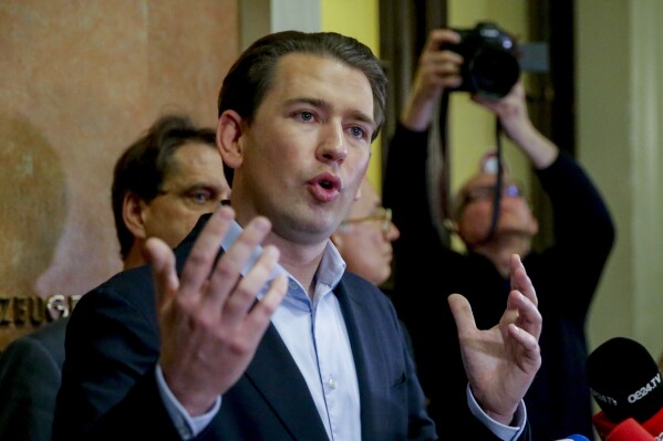 Former Austrian Chancellor Sebastian Kurz talks to media people after the verdict of his trial in Vienna, Austria, Friday, Feb.23, 2024. A judge has convicted Kurz of making false statements to a parliamentary inquiry. (AP Photo/Heinz-Peter Bader, File)