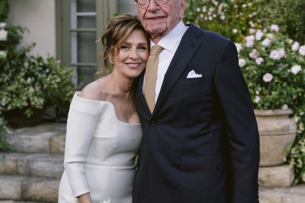 This image provided by News Corp. shows Rupert Murdoch and Elena Zhukova posing for a photo, Saturday, June 1, 2024 during their wedding ceremony at his vineyard estate in Bel Air, Calif. (News Corp. via AP)