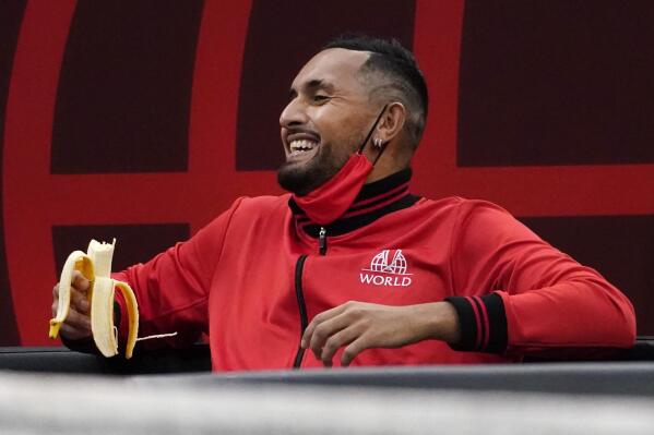 Team World's Nick Kyrgios, of Australia, laughs with teammates on the bench as they watch Team World's John Isner, of the USA, compete against Team Europe's Alexander Zverev, of Germany, during Laver Cup tennis, Saturday, Sept. 25, 2021, in Boston. (AP Photo/Elise Amendola)