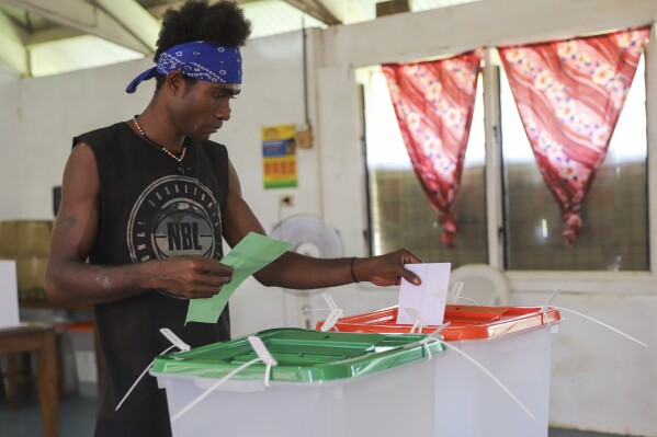 A man casts his vote during the Solomon Islands elections in a village on the island of San Cristobal, Wednesday, April 17, 2024. Voting has closed across Solomon Islands on Wednesday in the South Pacific nation's first general election since the government switched diplomatic allegiances from Taiwan to Beijing and struck a secret security pact that has raised fears of the Chinese navy gaining a foothold in the region. (AP Photo/Charley Piringi)