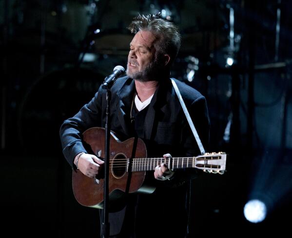 FILE - John Mellencamp performs during a tribute concert to Billy Joel, the recipient of the Library of Congress Gershwin Prize for Popular Song in Washington on Nov. 19, 2014. Mellencamp's 1985 album “Scarecrow” is being reissued this week. (AP Photo/Carolyn Kaster, File)
