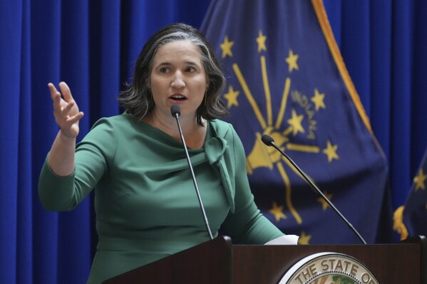 FILE - Indiana State Auditor Tera Klutz speaks after being sworn into office, Jan. 9, 2023, at the Indiana Statehouse in Indianapolis. Klutz will resign in November after nearly seven years in the state post that recently saw her title changed from Indiana’s state auditor to comptroller. Klutz submitted her resignation Thursday, Sept. 28 2023 to Gov. Eric Holcomb and notified her staff that she will continue as comptroller through Nov. 30. (Jenna Watson/The Indianapolis Star via AP, file)
