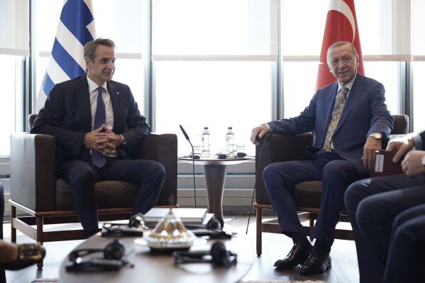 FILE - In this photo provided by the Greek Prime Minister's Office, Greek Prime Minister Kyriakos Mitsotakis, left, meets with Turkish President Recep Tayyip Erdogan on the sidelines of the United Nations General Assembly in New York on Sept. 20, 2023. Erdogan will fly to Greece Thursday, Dec. 7, 2023 on a visit designed to set the historically uneasy neighbors on a more constructive path. (Dimitris Papamitsos/Greek Prime Minister's Office via AP, File)
