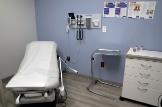 FILE - An exam room is seen inside Planned Parenthood on March 10, 2023. A lawsuit filed by 17 states challenging federal rules entitling workers to time off and other accommodations for abortions lacks standing, a federal judge in Arkansas ruled on Friday, June 14, 2024 (AP Photo/Jeff Roberson, File)