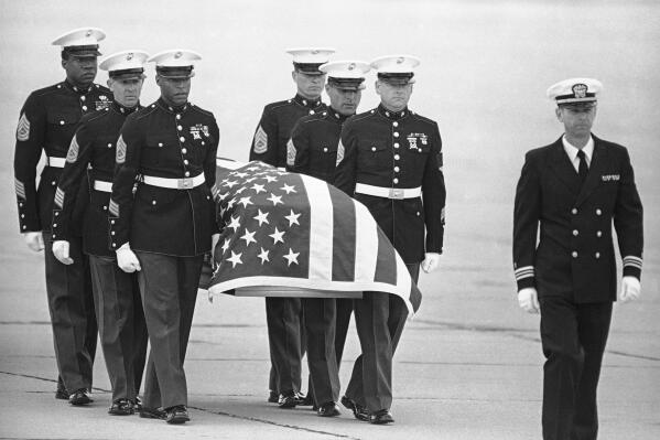 FILE - In this March 8, 1985, file photo, U.S. Marine Corps pallbearers carry the casket holding the body of slain U.S. Drug Enforcement agent Enrique Camarena Salazar after it arrived at North Island Naval Air Station, in San Diego. Mexican drug lord Rafael Caro Quintero was only ever sentenced in Mexico for the killing of Camarena and Mexican pilot Alfredo Zavala Avelar in 1985, but his gang apparently killed as many as six U.S. citizens in the western city of Guadalajara around the same time. (AP Photo/Lenny Ignelzi, File)