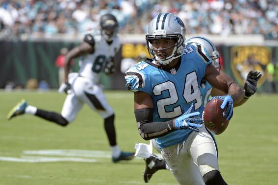 FILE - Carolina Panthers cornerback Josh Norman (24) runs back an interception against the Jacksonville Jaguars for a 30-yard touchdown during the second half of an NFL football game on Sept. 13, 2015, in Jacksonville, Fla. The Panthers worked out 35-year-old cornerback Norman on Monday, Dec. 26, 2022, because starter Jaycee Horn’s status for Sunday’s crucial game against the Tampa Bay Buccaneers is up in the air. (AP Photo/Phelan M. Ebenhack, File)