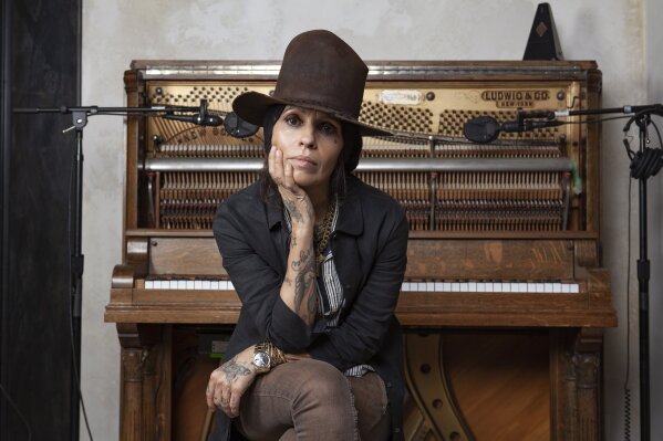 
              In this Jan. 23, 2019 photo, Linda Perry poses for a portrait at her studio in Los Angeles. A benefit gala honoring Linda Perry will include a performance by Rock and Roll Hall of Famers Cheap Trick and appearances from Oscar-nominated actress Juliette Lewis and Perry’s actress-wife, Sara Gilbert. “Linda Perry & Friends: A Night at the GRAMMY Museum” will take place June 29 in Los Angeles at The Novo at L.A. Live. (Photo by Rebecca Cabage/Invision/AP)
            