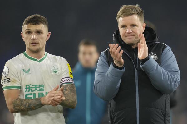 Newcastle's head coach Eddie Howe, right, and Newcastle's Kieran Trippier greet supporters after the English Premier League soccer match between Crystal Palace and Newcastle at the Selhurst Park Stadium in London, Saturday, Jan. 21, 2023. (AP Photo/Kirsty Wigglesworth)