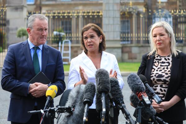 Sinn Fein's Conor Murphy, left, party leader Mary Lou McDonald, center, and Michelle O'Neill speak to the media at Hillsborough Castle, Northern Ireland, Monday, May, 16, 2022. British Prime Minister Johnson said there would be “a necessity to act” if the EU doesn't agree to overhaul post-Brexit trade rules that he says are destabilizing Northern Ireland's delicate political balance. Johnson was holding private talks with the leaders of Northern Ireland's main political parties, urging them to get back to work. (AP Photo/Peter Morrison)