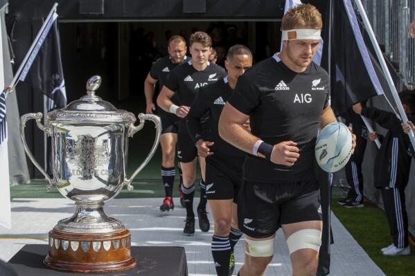 All Blacks captain Sam Cane leads his team onto the field for the second Bledisloe Rugby test between the All Blacks and the Wallabies at Eden Park in Auckland, New Zealand, Sunday, Oct. 18, 2020. Cane announced Monday May 13, 2024 that he was retiring from international rugby at the end of the 2024 season. (AP Photo/Mark Baker)