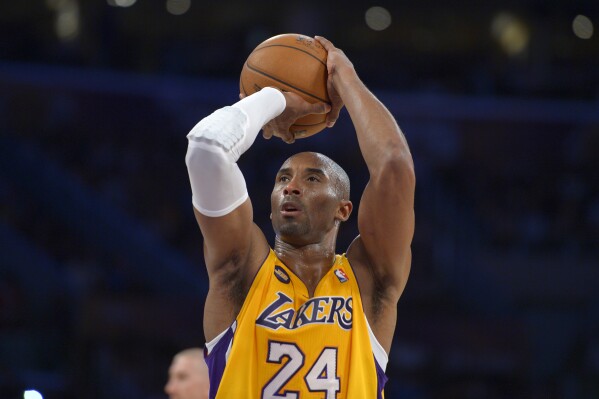 FILE - Los Angeles Lakers guard Kobe Bryant shoots a free throw during an NBA basketball game against the Golden State Warriors on April 12, 2013, in Los Angeles. The Los Angeles Lakers will unveil a statue of Kobe Bryant outside their downtown arena on Feb. 8, 2024. The 17-time NBA champion Lakers announced the plan Thursday, Aug. 24, 2023, to honor Bryant, the fourth-leading scorer in NBA history and a beloved mainstay of the franchise for 20 seasons. (AP Photo/Mark J. Terrill, File)