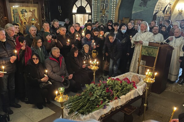 FILE - Relatives and friends pay their last respects at the coffin of Russian opposition leader Alexei Navalny in the Church of the Icon of the Mother of God Soothe My Sorrows, in Moscow, Russia, on Friday, March 1, 2024. Navalny's death at age 47 at an Arctic prison where he was serving a 19-year sentence on extremism charges caused global outrage. (AP Photo, File)