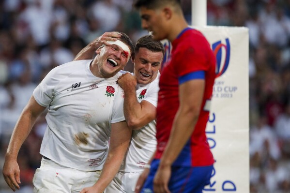 England's Jack Willis celebrates after scoring a try during the Rugby World Cup Pool D match between England and Chile at the Stade Pierre Mauroy in Villeneuve-d'Ascq, outside Lille, Saturday, Sept. 23, 2023. (AP Photo/Michel Spingler)