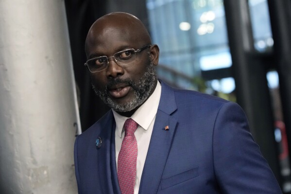 FILE - Liberia's President George Weah arrives to attend the Paris Peace Forum, in Paris, Nov. 11, 2021. Weah conceded defeat late Friday, Nov. 17, 2023, after provisional results from the week’s runoff vote showed challenger Joseph Boakai beating him by just over a percentage point. (AP Photo/Christophe Ena, File)