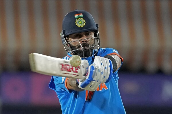 India's Virat Kohli plays a shot during the ICC Men's Cricket World Cup match between India and New Zealand in Dharamshala, India, Sunday, Oct. 22, 2023. (AP Photo/Manish Swarup)