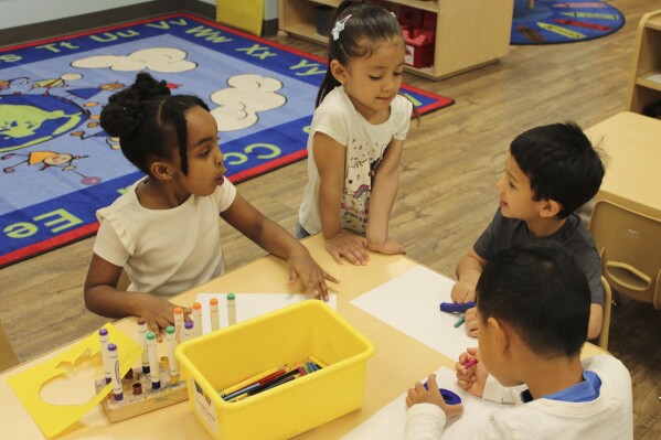 Children color at the KinderCare Child Development center on April 18, 2024, in Las Vegas. Just under 100 children of employees were enrolled at the The Venetian Las Vegas' center as of mid-April. (Jackie Valley/The Christian Science Monitor via AP)