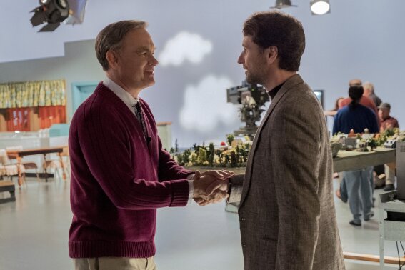 This image released by Sony Pictures shows Tom Hanks, left, and Matthew Rhys in a scene from "A Beautiful Day In the Neighborhood," in theaters on Nov. 22. (Lacey Terrell/Sony-Tristar Pictures via AP)