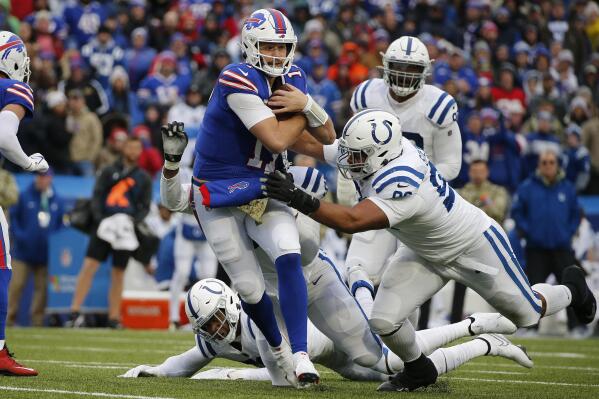 Buffalo Bills quarterback Josh Allen (17) is tackled by Indianapolis Colts defensive tackle Antwaun Woods (96) during the first half of an NFL football game in Orchard Park, N.Y., Sunday, Nov. 21, 2021. (AP Photo/Jeffrey T. Barnes)