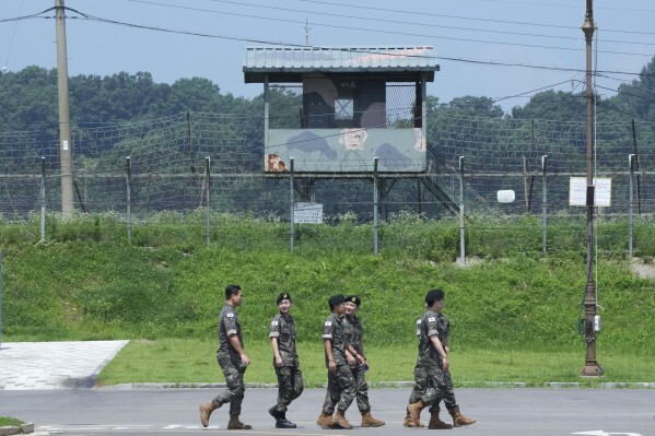 FILE - South Korean army soldiers pass by a military guard post at the Imjingak Pavilion in Paju, South Korea, near the border with North Korea, Wednesday, July 19, 2023. South Korea and the United States began large annual military exercises Monday, March 4, 2024, to bolster their readiness against North Korean nuclear threats after the North raised animosities with an extension of missile tests and belligerent rhetoric earlier this year.(AP Photo/Ahn Young-joon, File)