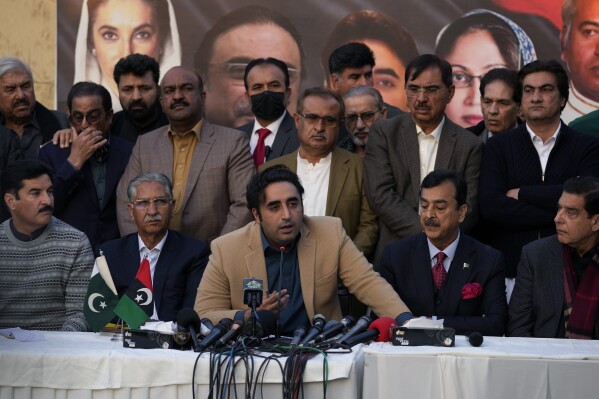 Bilawal-Bhutto Zardari, center bottom, Chairman of Pakistan People's Party speaks as party aids watch during a press conference regarding parliamentary elections, in Islamabad, Pakistan, Tuesday, Feb. 13, 2024. The main political rival of ex-Pakistani premier Imran Khan challenged him Tuesday to form a government if he had the support of the majority of newly elected lawmakers. The challenge by Shehbaz Sharif, who heads the Pakistan Muslim League party, follows national elections that showed candidates backed by Khan's Pakistan Tehreek-e-Insaf party won the most parliamentary seats but not enough to form a government alone. (AP Photo/Anjum Naveed)