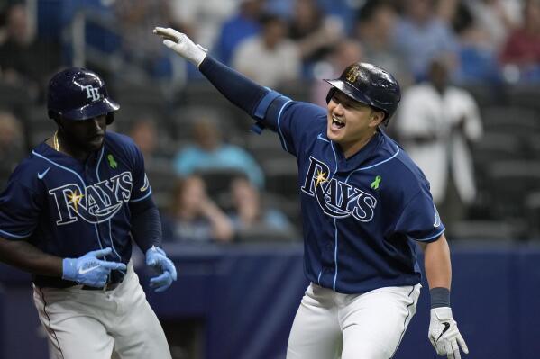 Tampa Bay Rays' Ji-Man Choi, right, celebrates his two-run home run off Miami Marlins starting pitcher Pablo Lopez with Randy Arozarena during the sixth inning of a baseball game Tuesday, May 24, 2022, in St. Petersburg, Fla. (AP Photo/Chris O'Meara)