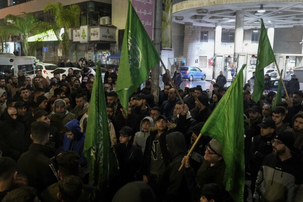 Palestinian demonstrators wave Hamas flags and shout slogans during a protest following the killing of top Hamas official Saleh Arouri in Beirut, in the West Bank city of Nablus on Tuesday, Jan. 2, 2024. Arouri, the No. 2 figure in Hamas, was killed in an explosion blamed on Israel. He is the highest-ranked Hamas figure to be killed in the nearly three-month war between Israel and Hamas. (AP Photo/Majdi Mohammed)