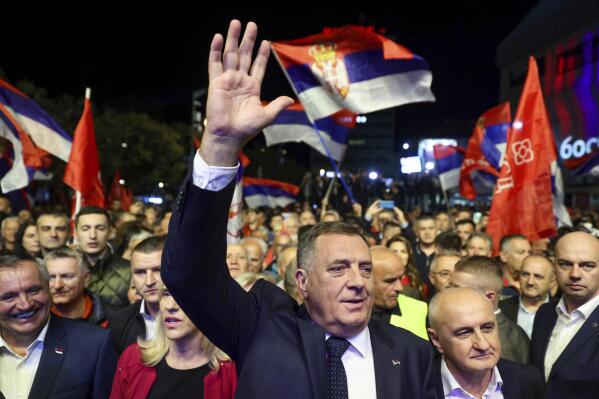 Bosnian Serb leader and member of the Bosnian Presidency Milorad Dodik waves as he leads thousands who gathered to support the "people's rally for the defense of Republika Srpska" protest in Banja Luka, Bosnia, Tuesday, Oct. 25, 2022. Tens of thousands of people rallied in Bosnia Tuesday to demand from electoral authorities to end a recount of ballots cast in one of the races in the country’s Oct. 2 general election and confirm a staunchly pro-Russian politician as the president of its Serb-run part. (AP Photo/Armin Durgut)