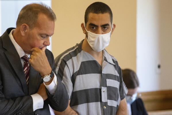 Defense attorney Nathaniel Barone, left, and Hadi Matar, 24, right, listen during an arraignment in the Chautauqua County Courthouse in Mayville, NY., Thursday, Aug. 18, 2022.  Matar was arrested Aug. 12 after he rushed the stage at the Chautauqua Institution and stabbed Salman Rushdie in front of a horrified crowd. (AP Photo/Joshua Bessex)