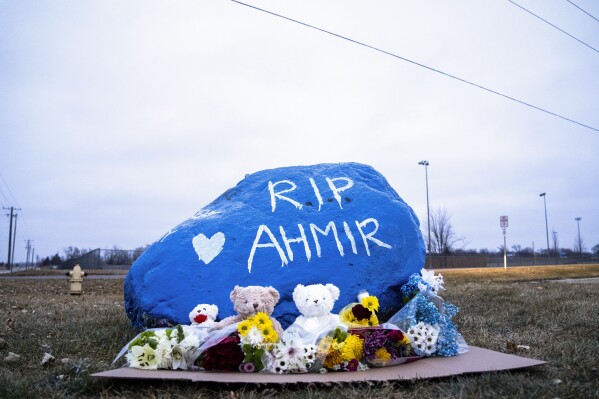 A rock is painted to memorialize Perry High School shooting victim Ahmir Jolliff at the school on Saturday, Jan. 6, 2024, in Perry, Iowa. (Lily Smith/The Des Moines Register via AP)