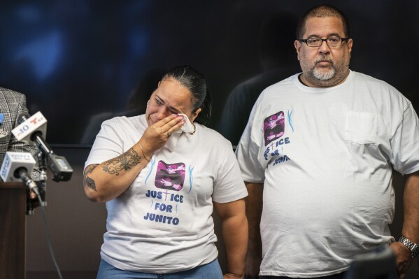 Zoraida Garcia, left, the aunt, and Eddie Irizarry, the father, are shown here during a press conference at the Law Offices of Shaka Johnson, LLC, in Philadelphia, Tuesday, Aug.22, 2023. Irizarry is the 27-year-old man shot and killed by a Philadelphia police officer. (Jessica Griffin/The Philadelphia Inquirer via AP)