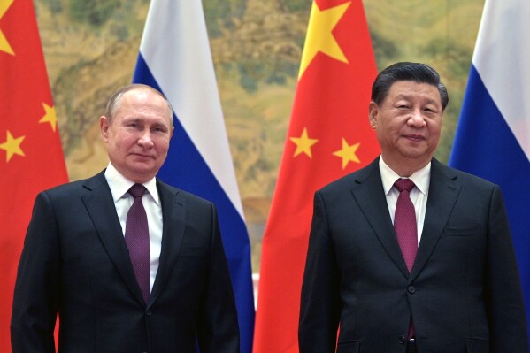 FILE - Chinese President Xi Jinping, right, and Russian President Vladimir Putin pose for a photo prior to their talks in Beijing, China, Friday, Feb. 4, 2022. Russian President Putin is expected to meet this week with Chinese leaders in Beijing on a visit that underscores China’s economic and diplomatic support for Moscow during its war in Ukraine. (Alexei Druzhinin, Sputnik, Kremlin Pool Photo via AP, File)