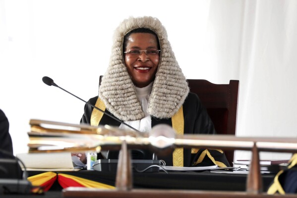 FILE - Speaker of the Parliament of Uganda Anita Among listens to Ugandan President Yoweri Museveni, as he delivers a 'State of the Nation' address at Kololo independence grounds in Kampala, Uganda, Wednesday, Feb 14, 2024. The United States on Thursday imposed sanctions on Uganda's parliamentary speaker and other officials over alleged corruption and serious abuses of human rights. Speaker Anita Among has been sanctioned 