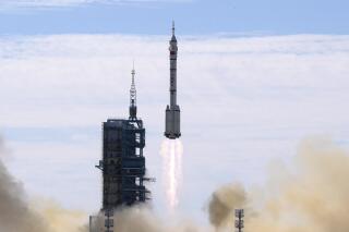 FILE - A Long March-2F Y12 rocket carrying a crew of Chinese astronauts in a Shenzhou-12 spaceship lifts off at the Jiuquan Satellite Launch Center in Jiuquan in northwestern China, Thursday, June 17, 2021. China has recommitted itself to completing its orbiting space station by the end of the year and says it is planning more than 40 launches for 2022, putting it roughly level with the United States. (AP Photo/Ng Han Guan, File)
