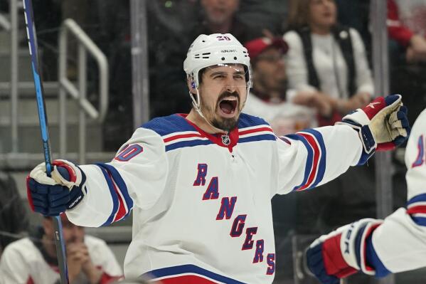 New York Rangers left wing Chris Kreider (20) celebrates his goal against the Detroit Red Wings in the third period of an NHL hockey game Wednesday, March 30, 2022, in Detroit. (AP Photo/Paul Sancya)