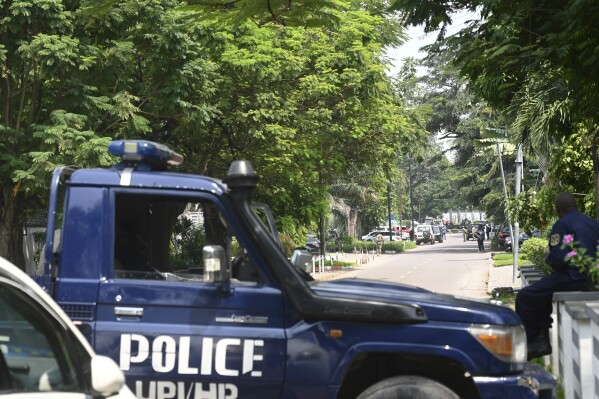 Congolese security forces secure the streets of Kinshasa, Democratic Republic of Congo, on Sunday May 19, 2024, after Congo's army said it has "foiled a coup" and arrested the perpetrators, including several foreigners, following a shootout between armed men in military uniform and guards of a close ally of Congo's president that left three people dead in the capital, Kinshasa. (AP Photo/Samy Ntumba Shambuyi)